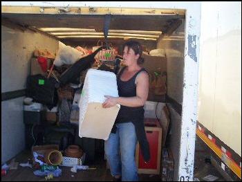 Volunteer unloading truck.