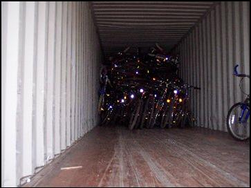 Donated bicycles tightly packed inside a truck.