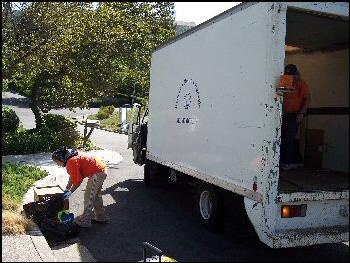 Employee of Pacific Rim Recycling making a pickup.