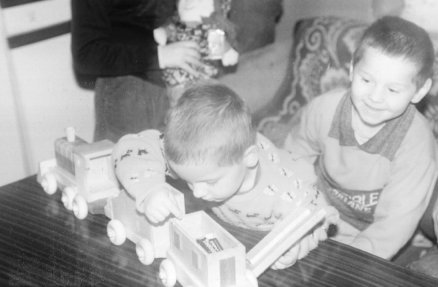 Children with wooden train