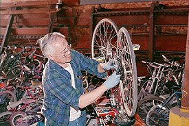 Roland repairing bicycles