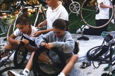 Children Fixing Bikes for Refugee Children